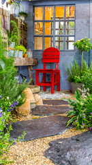 Relaxing area in cozy garden./ Relaxing area with garden object decoration on table in cozy garden. 
