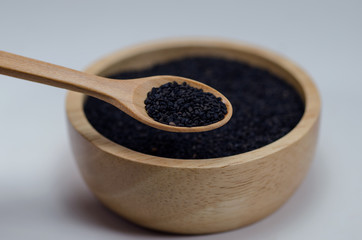 Black sesame on wooden spoon