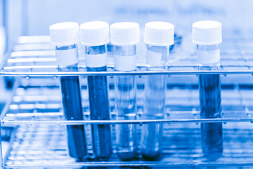 Medical research chemical lab concept - chemical sample science test in sci tube on blue color tone for background.