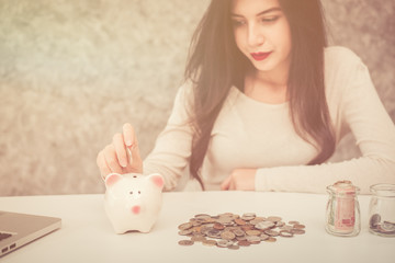 Beautiful young girl saving money for holiday season, saving money concept