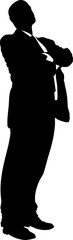 Powerful silhouette of a businessman standing with his arms folded.