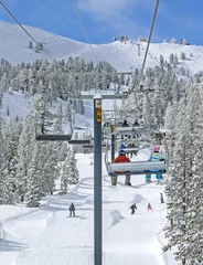 Afwasbaar fotobehang Winter ski lift riders © NatalieJean