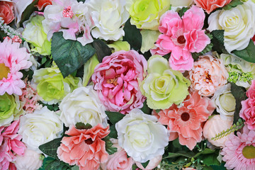 Artificial bouquet flowers background.