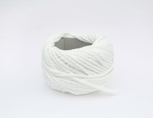 Roll of white yarn thread isolated on white background.