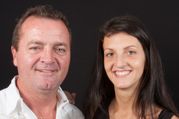 Portrait of smiling woman hugging her father