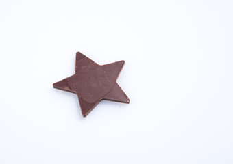 Chocolate or chocolate star on a background.