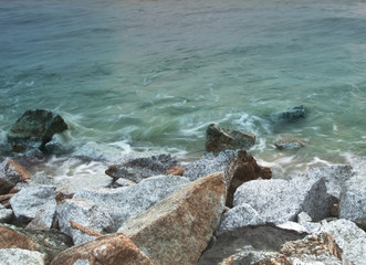 Sea waves crashing against rocks