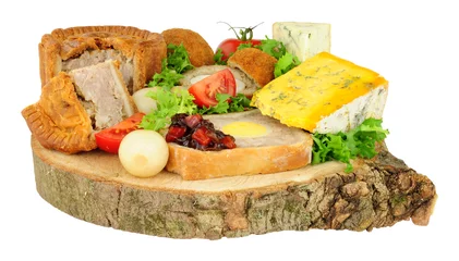 Foto op Canvas Traditional ploughman's buffet lunch ingredients isolated on a white background © philip kinsey