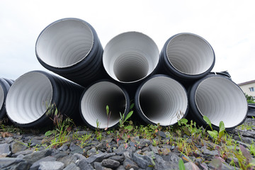 New black-and-white plastic pipes for sewerage system