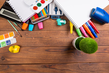 Desk cluttered with office supplies