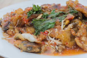 oysters fried in egg batter (Hoi Tod) on plate