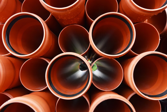 Large orange plastic pipes for sewerage system