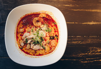 Tom Yum Goong (or Spicy prawn soup) mixed with meat ball noodles, Thai style and iconic popular taste of Thai foods.