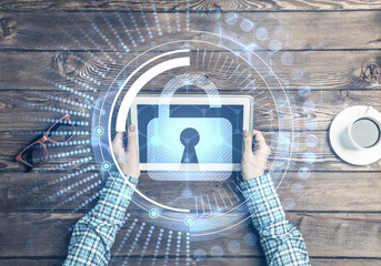 Concept of computer access with media lock icon on tablet screen