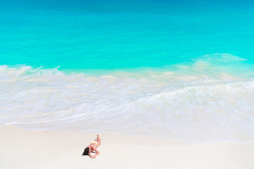 Young beautiful girl on the beach on the sashore