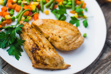 Breakfast on the wooden background from chicken breast