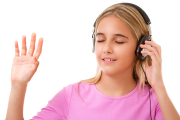 Fototapeta premium Picture of teenage lovely girl with headphones listening music with closed eyes isolated