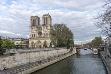 Fototapeta na wymiar Paris, France - April 28, 2016: panoramic view of Paris and Notre-Dame Cathedral. Notre-Dame de Paris is a medieval Catholic cathedral on the Ile de la Cité in the fourth arrondissement of Paris