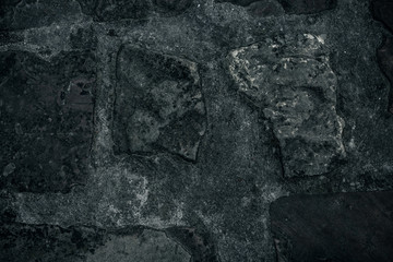 Old stone wall background, brick wall grunge texture close up.