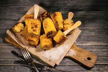 Grilled corn with oil and salt. Food background