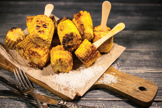 Grilled corn with oil and salt. Food background