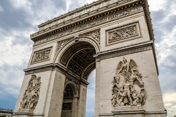 Fototapeta na wymiar Arc de Triomphe with moody storm clouds