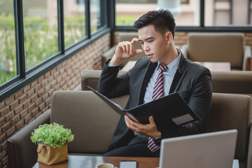young businessmen working with document file