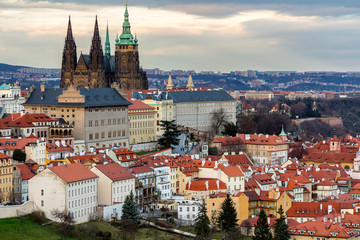 Obraz premium Spring Prague panorama from Prague Hill with Prague Castle, Vltava river and historical architecture. Concept of Europe travel, sightseeing and tourism.