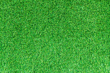 Artificial green grass texture for golf course. soccer field or sports background concept design.