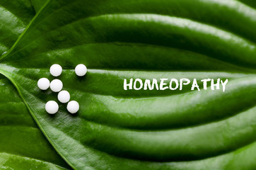 Closeup image of homeopathic medicine consisting of the pills