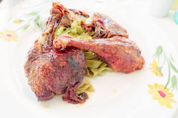 Roasted Duck leg, stewed with honey and ginger with green noodles