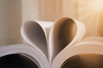 Book with hart shape made of pages, vintage effect style pictures