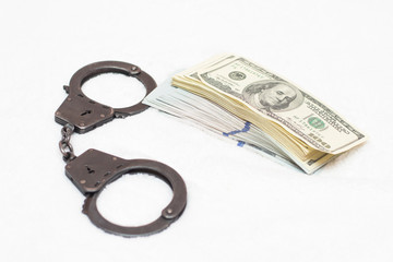 Money dollars and manacles isolated on white background