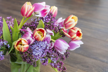 bouquet of pink tulips on a  wooden background 