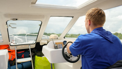 man drives the boat