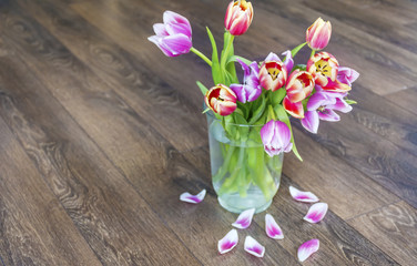 bouquet of pink  tulips  on a wooden background
