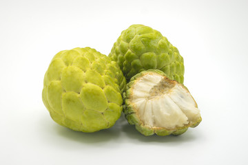 Two custard apples and one half custard apple, isolated on  white background.