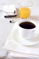 Morning coffee, orange juice and mobile phone