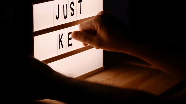 Just keep trying, motivational message on lightbox