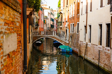 Fototapeta na wymiar Narrow canals are famous and typical in Venice.