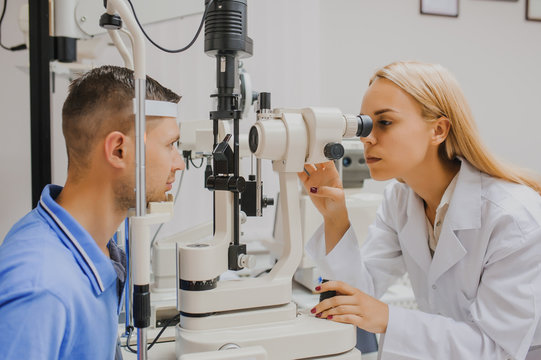 Young beautiful woman doctor/eye specialist/optometrist in an ophthalmologic clinic