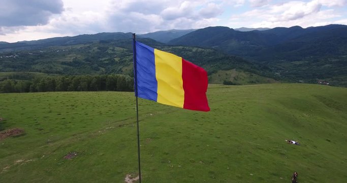 Romanian Flag blowing in the wind. 4K video footage taken with a drone