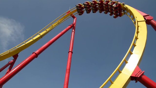 Roller coaster with blue sky (slow motion )