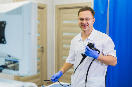 proctologist holding anoscope at hospital ward
