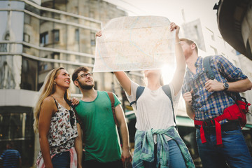 Happy group of tourists traveling and sightseeing