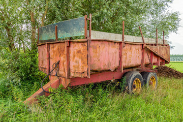 Old and rusty farm trailer