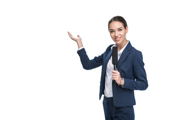 smiling female newscaster with microphone presenting something, isolated on white