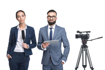 announcers with digital tablet standing near tv video camera, isolated on white