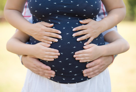 Cropped image of beautiful pregnant woman's tummy