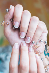 Lacquer on the nails of the hands. Fresh French manicure